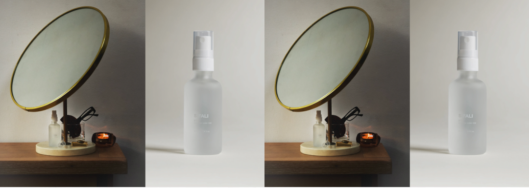 Sifali frosted glass rose water mist on a sunlit vanity with a round mirror
